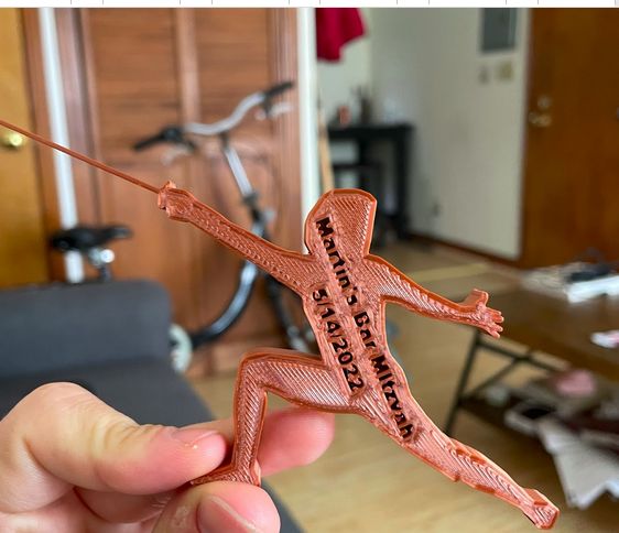 3D-printed fencer figurine personalized as a party favor