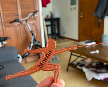 Fencer figurine personalized with a guest's name