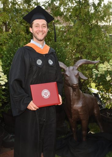 Jason Karlin in cap and gown at his WPI graduation
