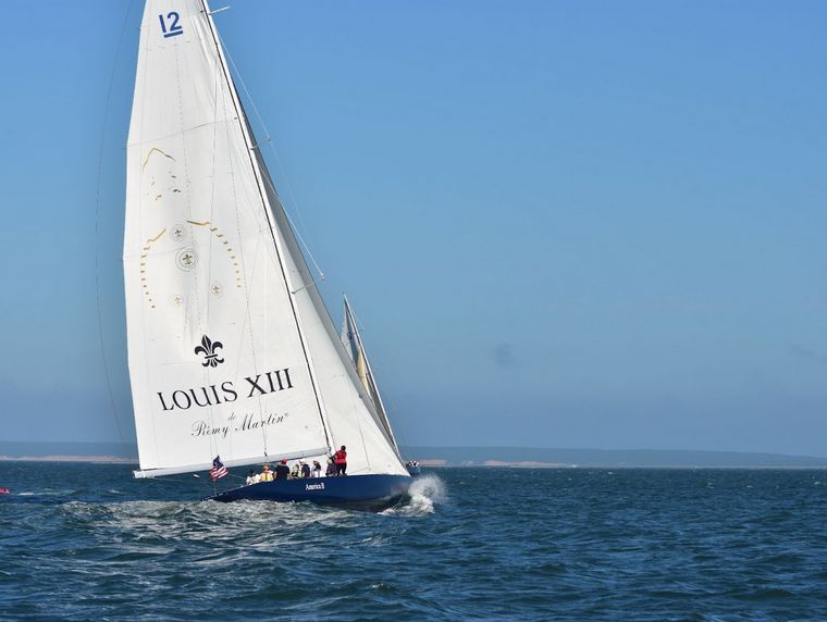 Keelboat sailing upwind on open water